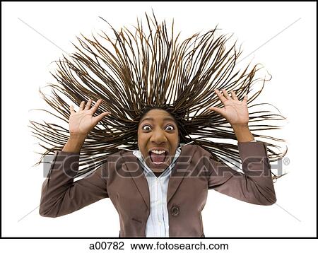 Stock Image - Woman with braided hair and wild expression. Fotosearch