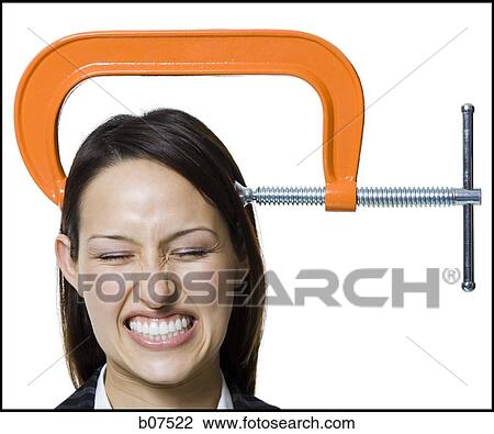 Stock Image - Woman with C-Clamp on head. Fotosearch