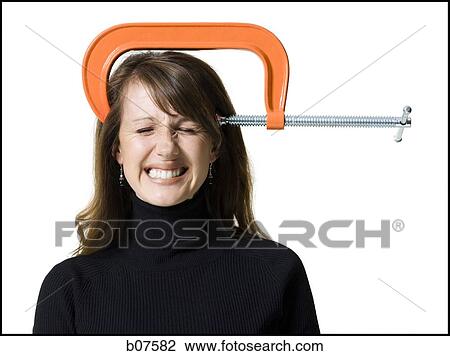 Woman with C-Clamp on head View Large Photo Image Stock Image - Woman with C-Clamp on head. Fotosearch
