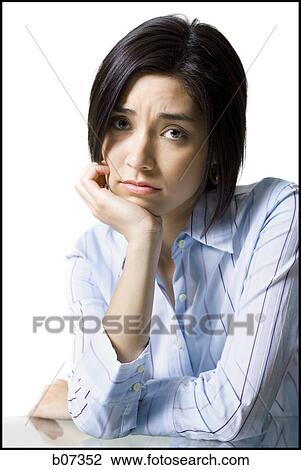 Woman with chin on hand View Large Photo Image Stock Image - Woman with chin on hand. Fotosearch