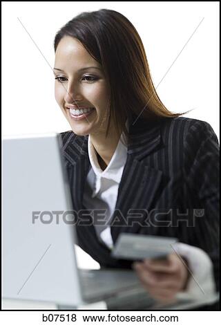 Woman with credit card shopping online View Large Photo Image Stock Photo - Woman with credit card shopping online. Fotosearch