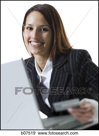 Woman with credit card shopping online View Large Photo Image Stock Photo - Woman with credit card shopping online. Fotosearch