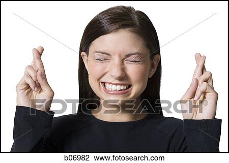 Woman with fingers crossed View Large Photo Image Stock Image - Woman with fingers crossed. Fotosearch