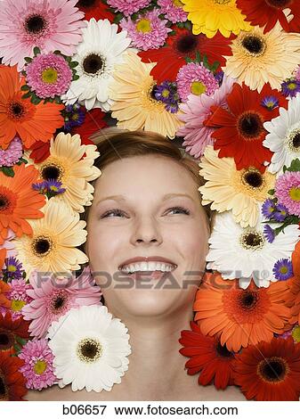 Woman with flower blossoms View Large Photo Image Stock Photo - Woman with flower blossoms. Fotosearch