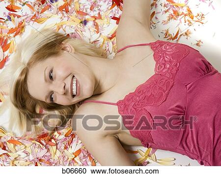 Woman with flower petals View Large Photo Image Stock Image - Woman with flower petals. Fotosearch