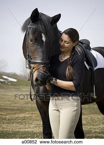 Stock Image - Woman with horse. Fotosearch