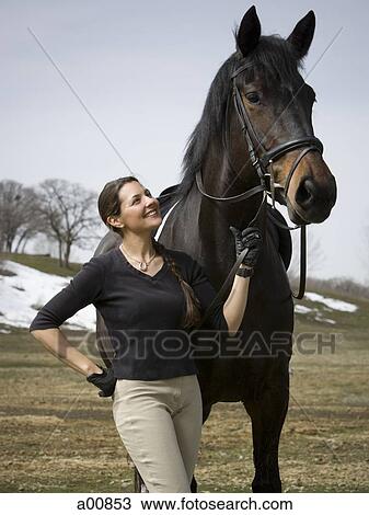 Woman with horse View Large Photo Image Stock Image - Woman with horse. Fotosearch