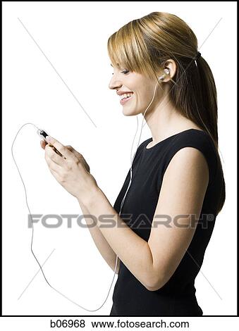 Woman with listening device and earbuds View Large Photo Image Stock Photo - Woman with listening device and earbuds. Fotosearch