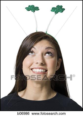 Woman with shammrock antennae View Large Photo Image Stock Photograph - Woman with shammrock antennae. Fotosearch