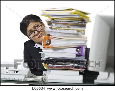 Woman with stack of binders and paperwork View Large Photo Image Picture - Woman with stack of binders and paperwork. Fotosearch