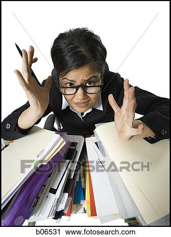 Woman with stack of binders and paperwork View Large Photo Image Stock Image - Woman with stack of binders and paperwork. Fotosearch