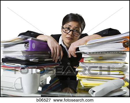 Woman with stack of binders View Large Photo Image Stock Photo - Woman with stack of binders. Fotosearch