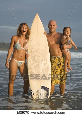 Woman with surfboard on beach View Large Photo Image Stock Image - Woman with surfboard on beach. Fotosearch