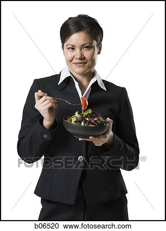 Stock Image - Woman with tossed salad. Fotosearch