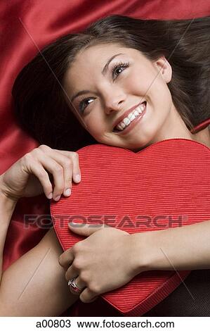 Woman with valentine heart View Large Photo Image Stock Image - Woman with valentine heart. Fotosearch