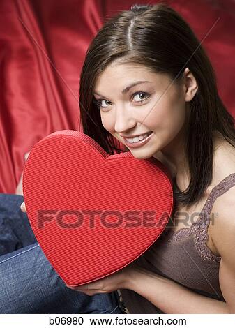 Woman with valentine heart View Large Photo Image Stock Image - Woman with valentine heart. Fotosearch