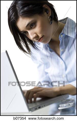 Woman working on laptop View Large Photo Image Picture - Woman working on laptop. Fotosearch