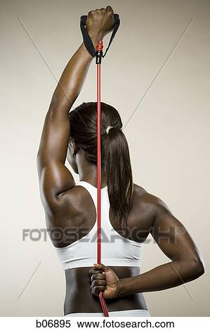 Stock Photography - Woman working out. Fotosearch