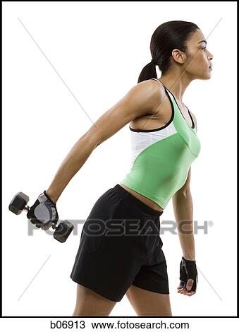 Woman working with dumbbell View Large Photo Image Stock Image - Woman working with dumbbell. Fotosearch