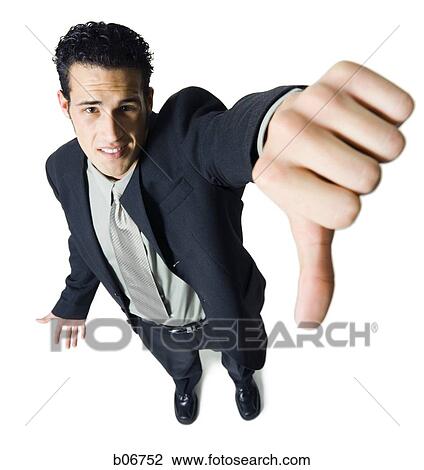 Young businessman giving thumbs down View Large Photo Image Stock Image - Young businessman giving thumbs down. Fotosearch