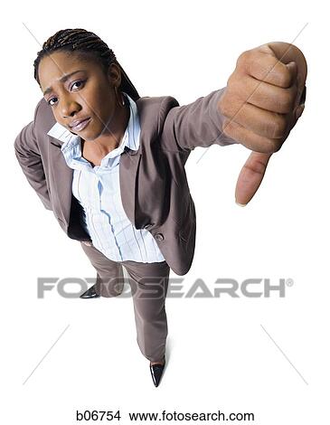Young businesswoman giving thumbs down View Large Photo Image Picture - Young businesswoman giving thumbs down. Fotosearch