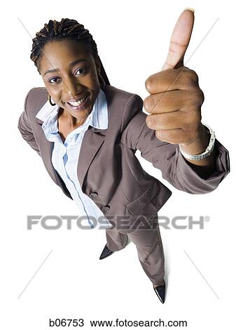 Young businesswoman giving thumbs up View Large Photo Image Stock Image - Young businesswoman giving thumbs up. Fotosearch