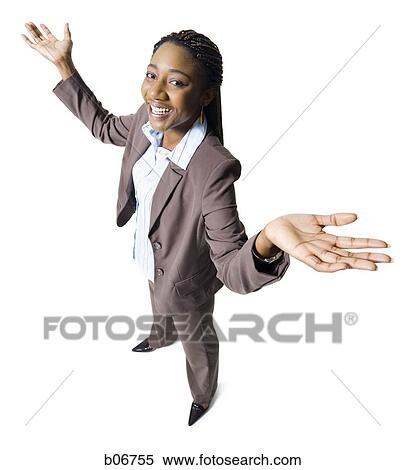 Stock Photography - Young businesswoman with hands in the air. Fotosearch