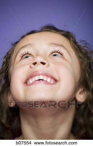Young girl gazing upwards View Large Photo Image Picture - Young girl gazing upwards. Fotosearch