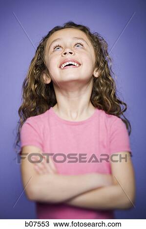 Young girl gazing upwards View Large Photo Image Stock Image - Young girl gazing upwards. Fotosearch
