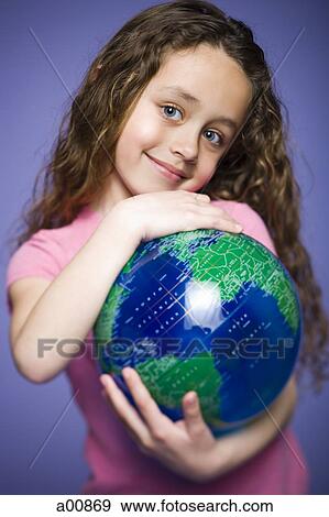 Young girl holding earth globe View Large Photo Image Stock Photo - Young girl holding earth globe. Fotosearch
