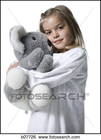 Young girl in nightie holding koala bear plush toy View Large Photo Image Stock Photograph - Young girl in nightie holding koala bear plush toy. Fotosearch
