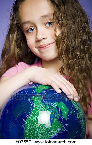 Young girl leaning on an earth globe View Large Photo Image Stock Photo - Young girl leaning on an earth globe. Fotosearch