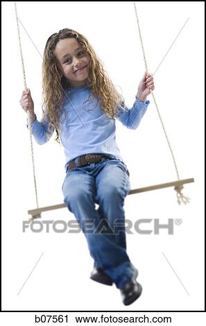 Young girl playing on a swing View Large Photo Image Stock Image - Young girl playing on a swing. Fotosearch