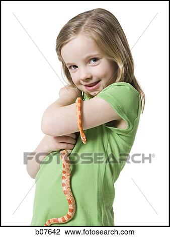Young girl playing with a snake View Large Photo Image Stock Image - Young girl playing with a snake. Fotosearch