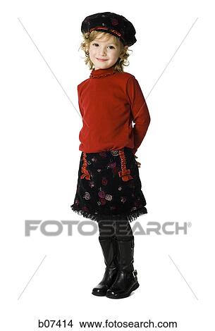 Young girl standing with arms behind back View Large Photo Image Picture - Young girl standing with arms behind back. Fotosearch