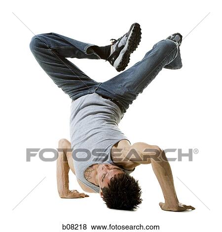 Young man break dancing View Large Photo Image Stock Photo - Young man break dancing. Fotosearch