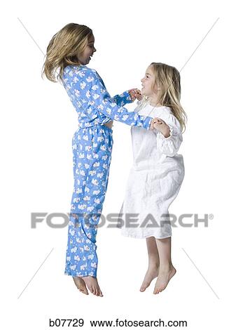 Young sisters in pajamas View Large Photo Image Stock Photo - Young sisters in pajamas. Fotosearch