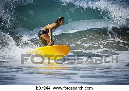Picture - Young woman surfer. Fotosearch
