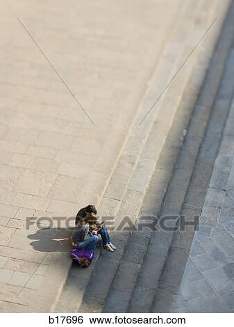 Aerial view of couple on stairs outdoors View Large Photo Image Stock Photograph - Aerial view of couple on stairs outdoors. Fotosearch