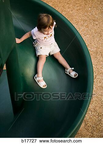 Stock Photo - Aerial view of girl on slide. Fotosearch