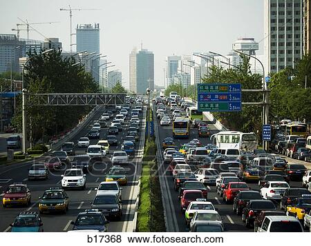 Aerial view of highway in city with traffic jam View Large Photo Image Stock Photo - Aerial view of highway in city with traffic jam. Fotosearch