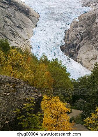 Picture - Aerial view of river rushing over rocks in autumn. Fotosearch