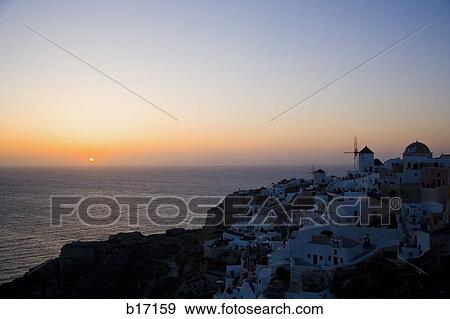 Aerial view of village on mountain with sunset over water View Large Photo Image Stock Photo - Aerial view of village on mountain with sunset over water. Fotosearch