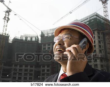 Architect on the job site. View Large Photo Image Picture - Architect on the job site.. Fotosearch