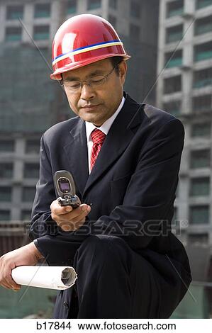 Architect on the job site. View Large Photo Image Picture - Architect on the job site.. Fotosearch