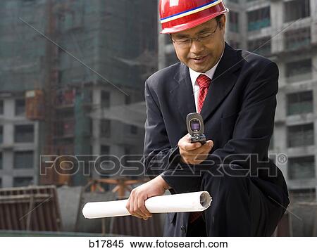 Stock Photography - Architect on the job site.. Fotosearch