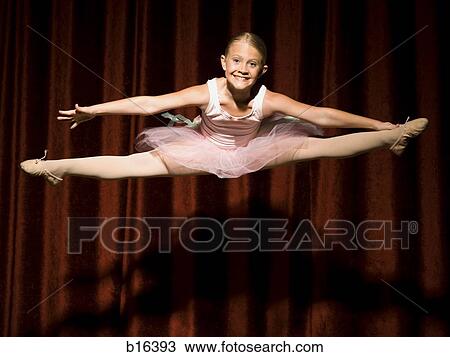 Ballerina girl on stage leaping and smiling View Large Photo Image Stock Image - Ballerina girl on stage leaping and smiling. Fotosearch