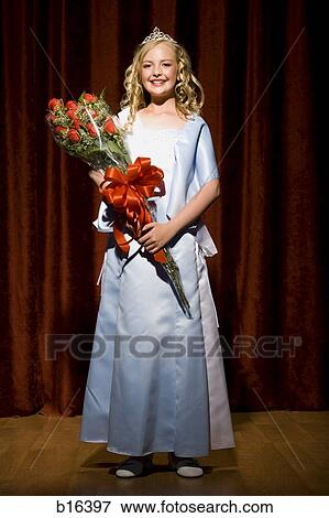 Beauty pageant winner smiling and holding roses View Large Photo Image Stock Photo - Beauty pageant winner smiling and holding roses. Fotosearch