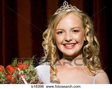 Beauty pageant winner smiling and holding roses View Large Photo Image Stock Photo - Beauty pageant winner smiling and holding roses. Fotosearch