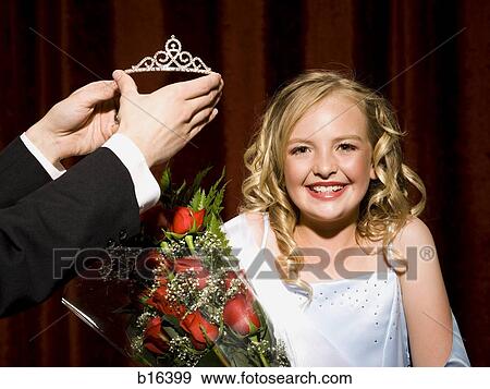 Beauty pageant winner smiling and holding roses View Large Photo Image Stock Photo - Beauty pageant winner smiling and holding roses. Fotosearch